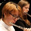 woman playing the flute in PCC orchestra